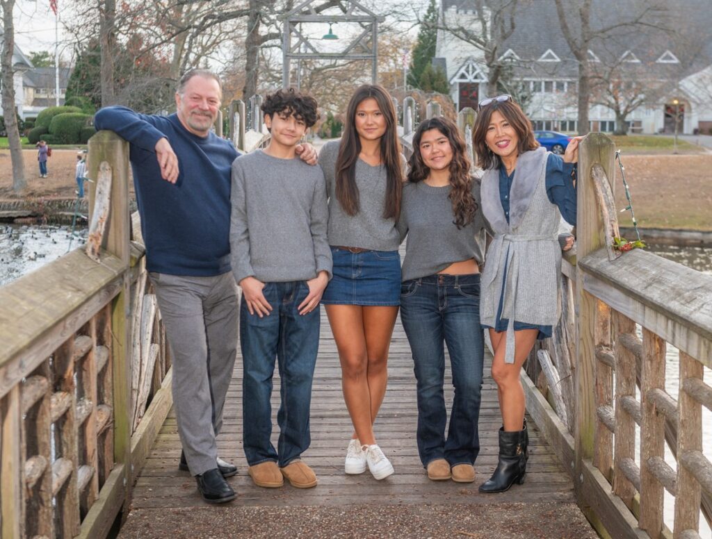 Ignatowicz family posing for a family photo on a Jersey Shore dock
